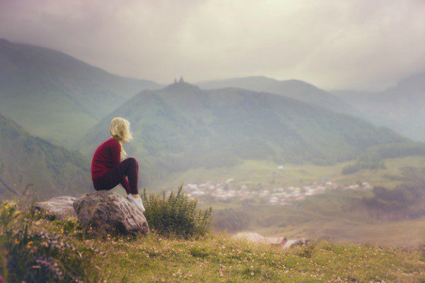 Woman alone in the mountains